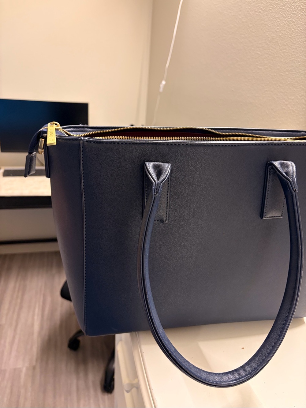Women’s Navy laptop tote with inside compartment for laptop, gold hardware